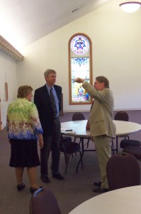 Pastor Phillip talks with Bob and Mary Swope