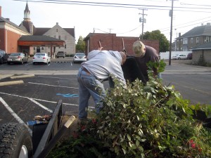 Richard and Doug load the wagon with clippings.